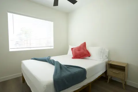ADU bedroom with daylight and ceiling fan