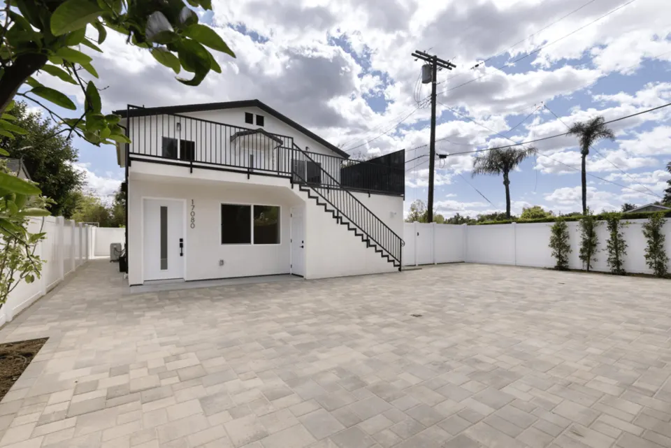 Exterior of the Los Angeles ADU and adjoining paved outdoor space